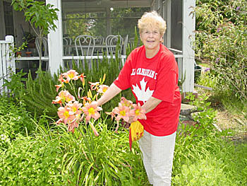 Pat shows off her lillies.